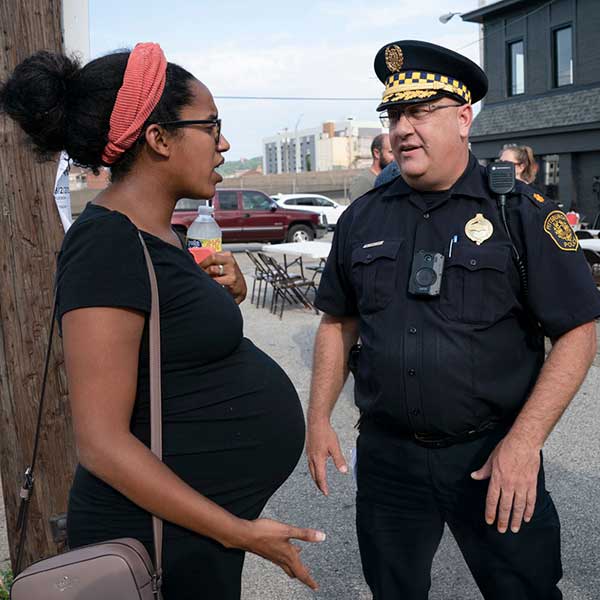 Officer speaking to a pregnant woman